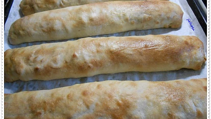 Úžasný "tažený" štrúdlík, Upečené a potřené máslem s rumem